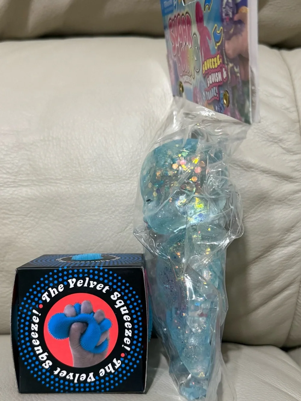 NeeDoh Blue Fuzz Ball Velvet Squeeze & ORB Toys Sugar Swaps Onsie Baby in Blue